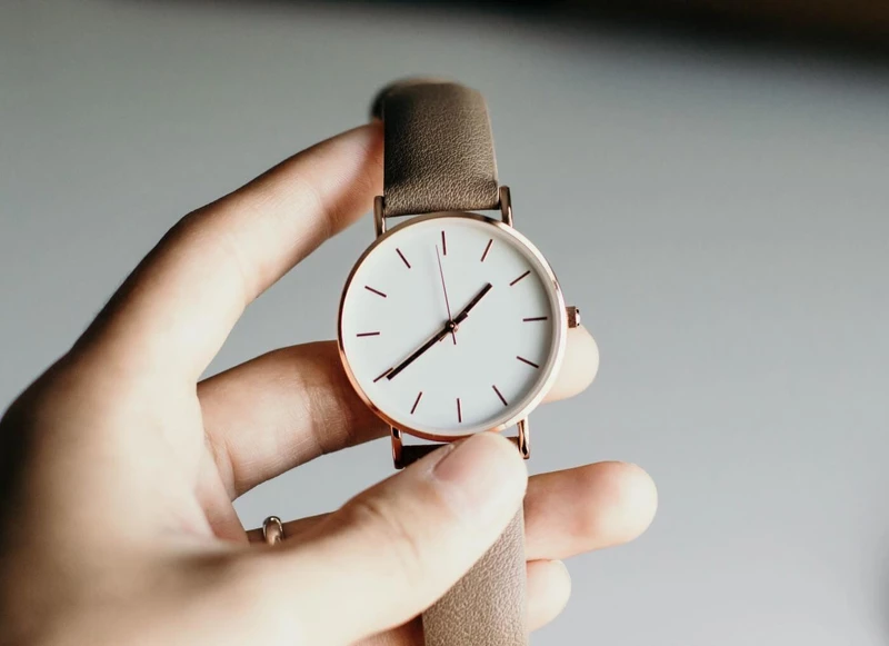 A hand showing a simple watch