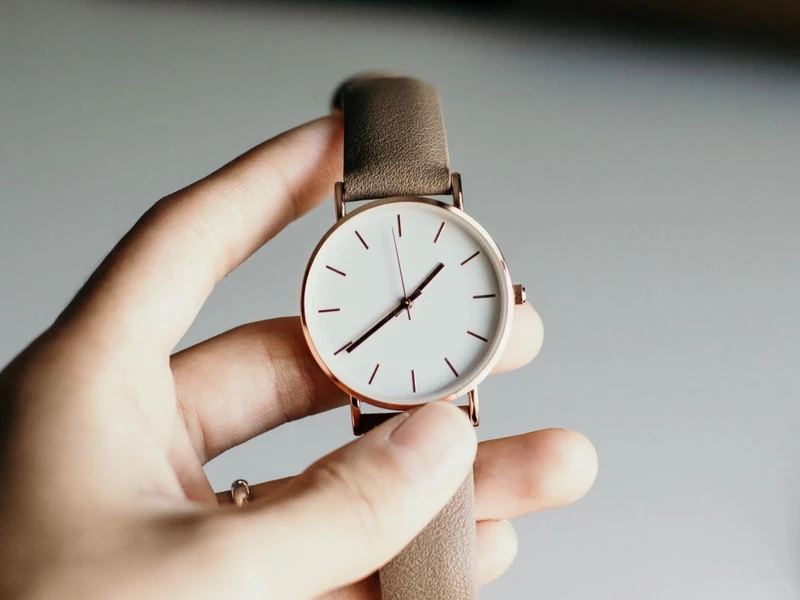 A hand showing a simple watch
